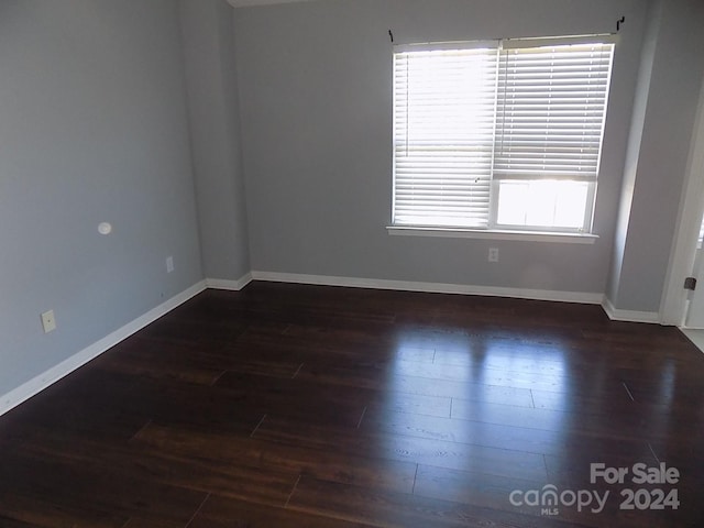 141 Rock Ridge Ln, Mount Holly, NC 28120 - spare room with baseboards and wood finished floors