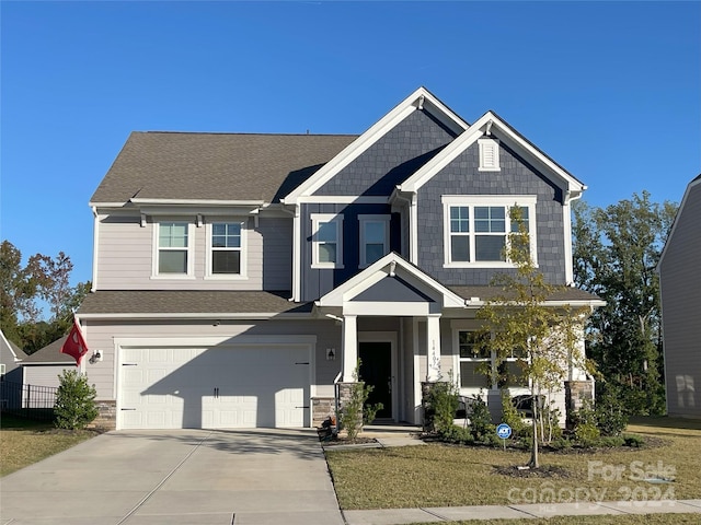 craftsman-style house featuring a garage