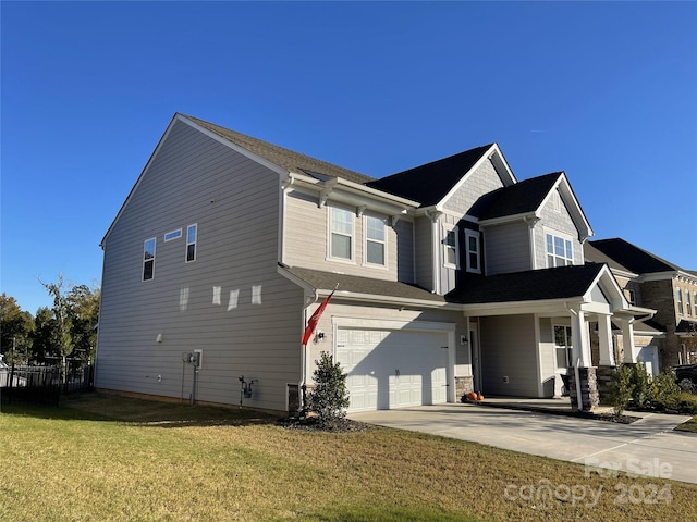 view of home's exterior with a garage and a lawn