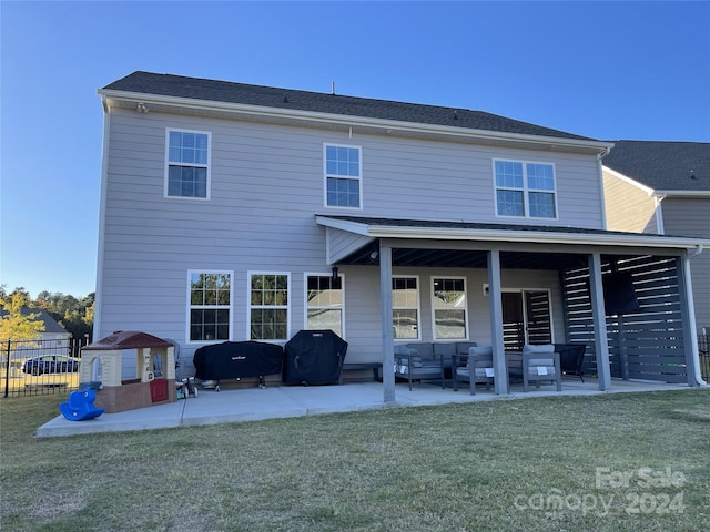 rear view of property with an outdoor hangout area, a yard, and a patio