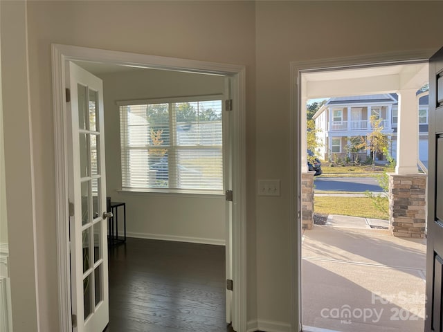 entryway with french doors and dark hardwood / wood-style floors