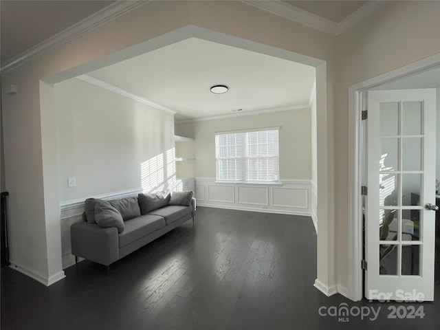 living room featuring ornamental molding and dark wood-type flooring