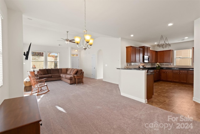 living room with carpet flooring and ceiling fan