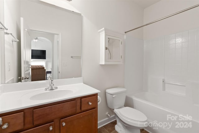 full bathroom featuring tile patterned floors, shower / bathtub combination, vanity, ceiling fan, and toilet