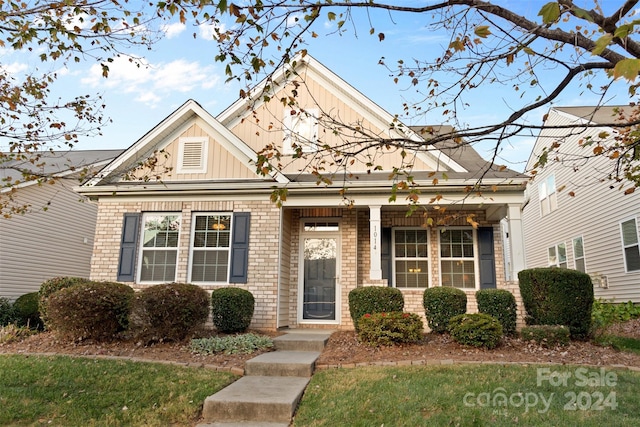 view of front of property with a pergola