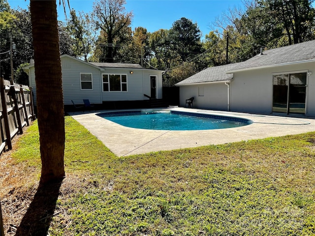 view of pool featuring a yard and a patio area