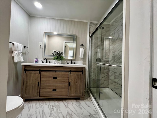 bathroom with vanity, ornamental molding, toilet, and walk in shower