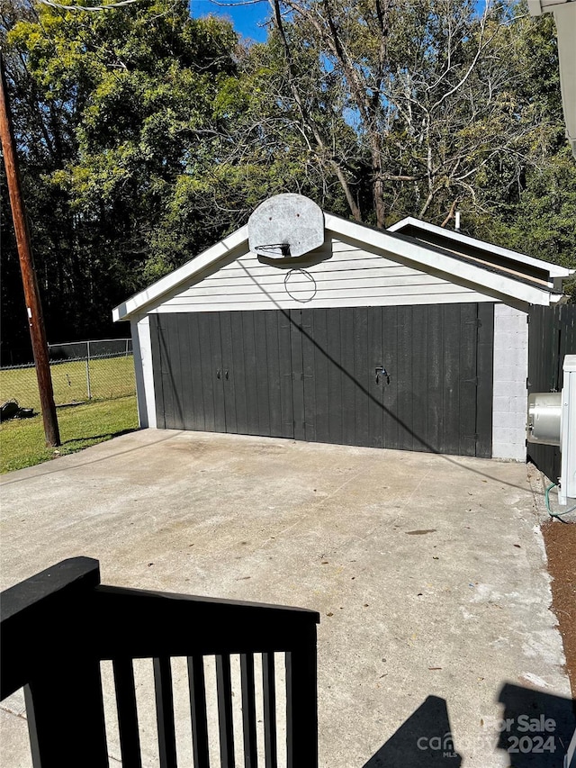 view of outbuilding featuring a lawn