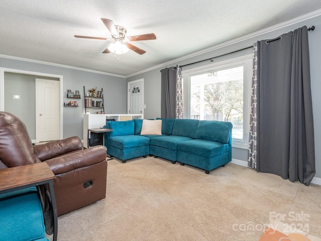 carpeted living room with a textured ceiling, ceiling fan, and crown molding