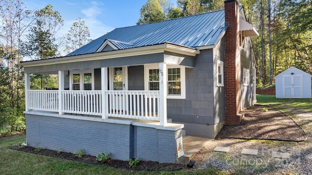 exterior space with a storage unit and covered porch