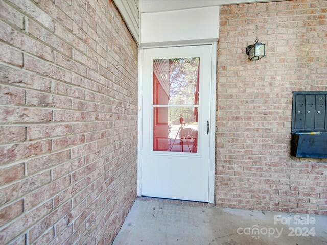 4605 Coronado Dr Unit M, Charlotte, NC 28212 - doorway to property featuring brick siding