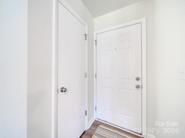 entryway with hardwood / wood-style floors