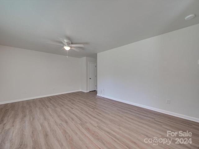 4605 Coronado Dr Unit M, Charlotte, NC 28212 - spare room featuring a ceiling fan, baseboards, and wood finished floors
