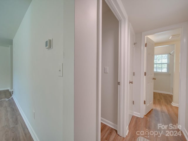 corridor featuring light wood-type flooring