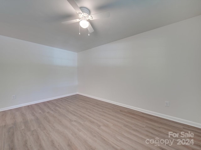 unfurnished room with ceiling fan and light wood-type flooring