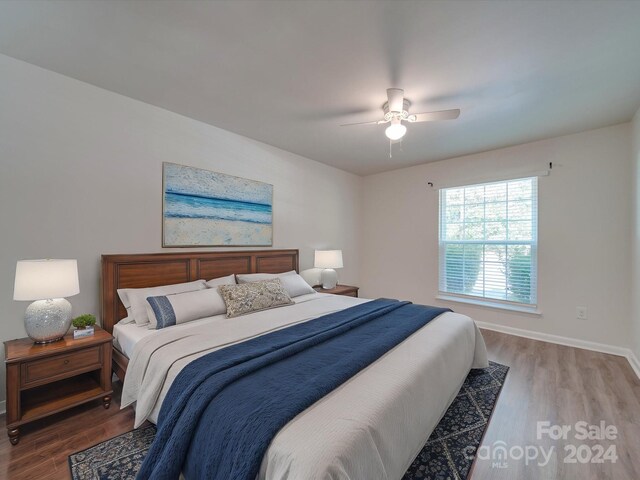 bedroom featuring ceiling fan and hardwood / wood-style floors