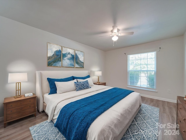 4605 Coronado Dr Unit M, Charlotte, NC 28212 - bedroom with baseboards, ceiling fan, and light wood finished floors