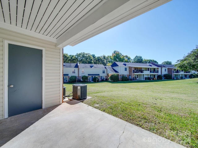 view of yard featuring a patio and central AC unit