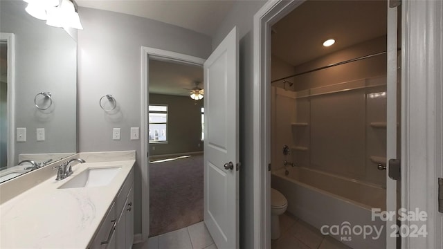 full bathroom with toilet, ceiling fan, tile patterned floors, vanity, and shower / bathtub combination