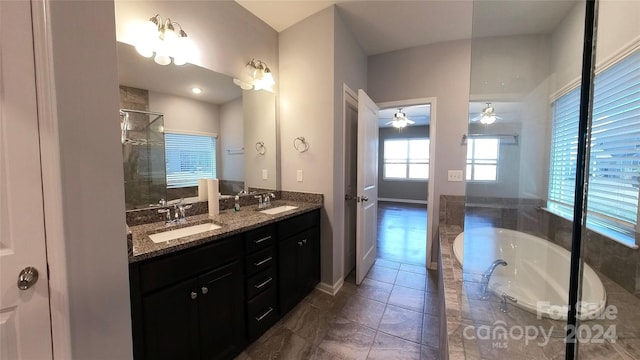 bathroom featuring vanity, plus walk in shower, tile patterned flooring, and ceiling fan