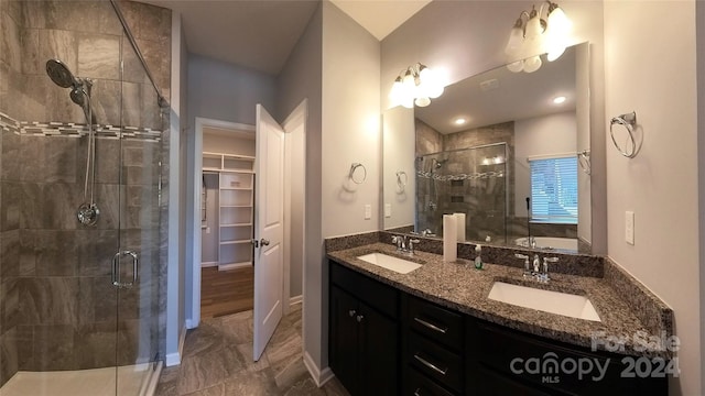 bathroom with vanity, an enclosed shower, and hardwood / wood-style floors