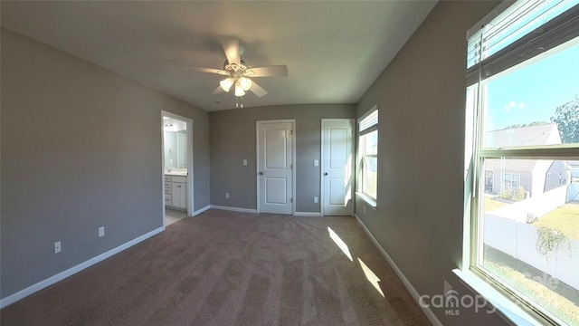 interior space with a healthy amount of sunlight and ceiling fan