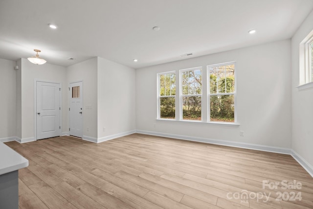 spare room featuring light hardwood / wood-style floors