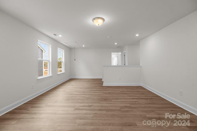 spare room featuring light hardwood / wood-style flooring