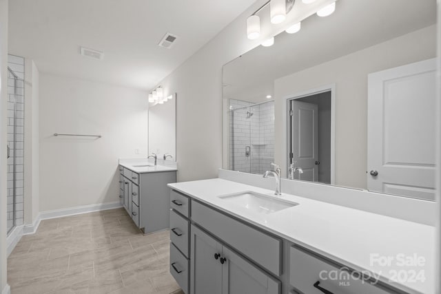 bathroom featuring walk in shower and vanity