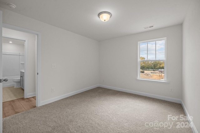 empty room with hardwood / wood-style flooring