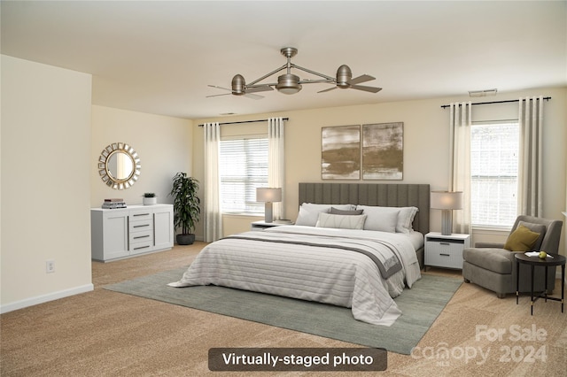 carpeted bedroom with ceiling fan