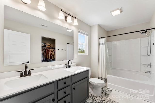 full bathroom with toilet, tile patterned flooring, vanity, and shower / tub combo with curtain