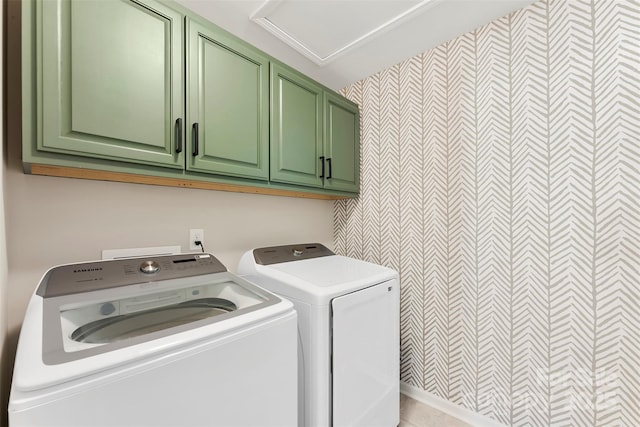 laundry room with cabinets and washing machine and clothes dryer