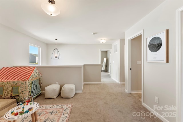 playroom with light colored carpet