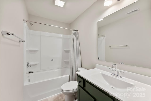 full bathroom featuring toilet, tile patterned floors, vanity, and shower / tub combo with curtain