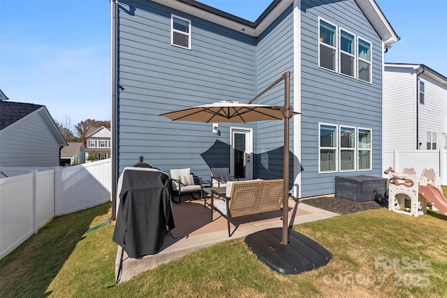 rear view of property featuring a patio area, an outdoor living space, and a lawn