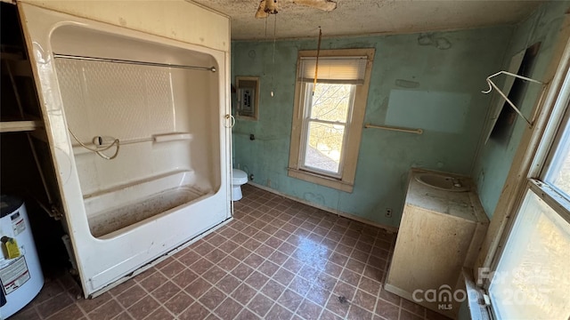 bathroom with electric panel, toilet, washtub / shower combination, vanity, and water heater