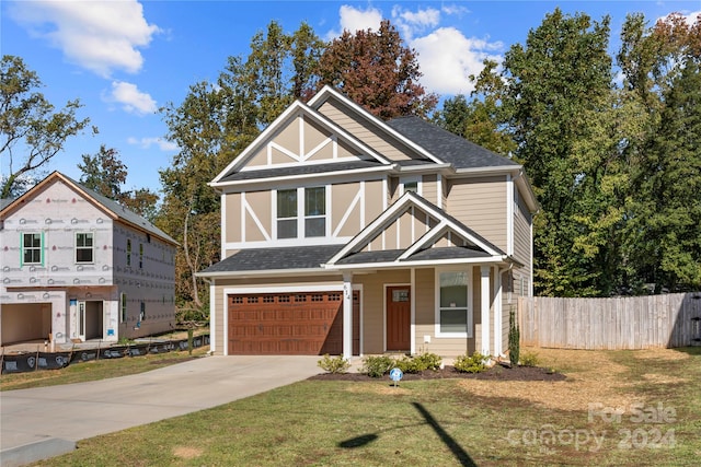 view of front facade with a garage and a front yard