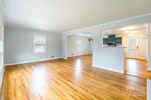 unfurnished living room featuring crown molding and wood-type flooring