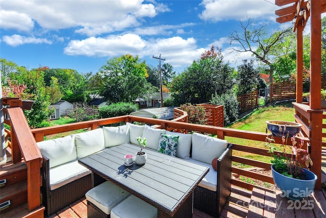 wooden terrace with outdoor lounge area