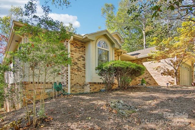 view of home's exterior with a garage