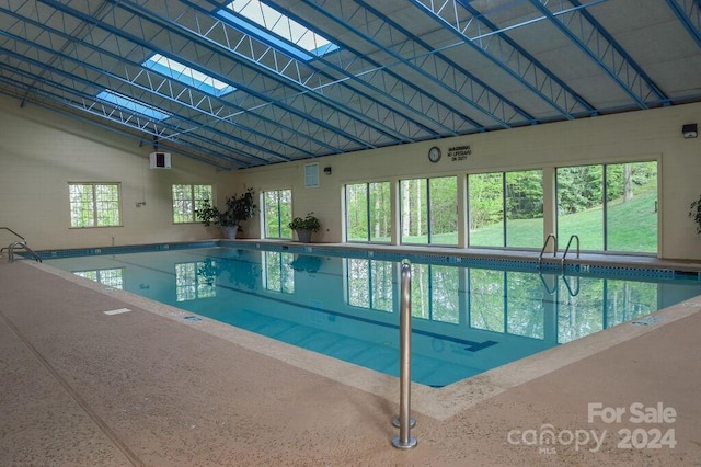 view of pool featuring a skylight