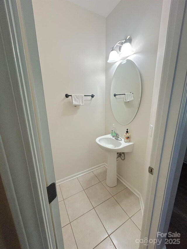 bathroom with tile patterned floors