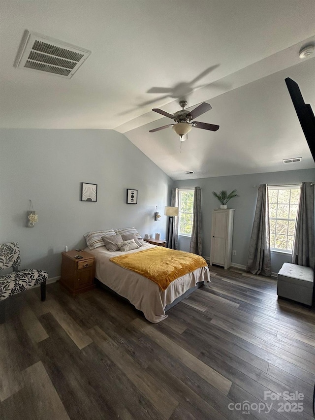 bedroom featuring ceiling fan, dark hardwood / wood-style floors, and lofted ceiling