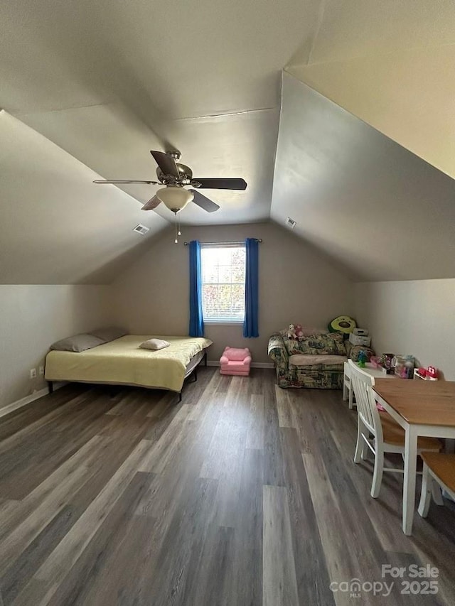 unfurnished bedroom featuring ceiling fan, dark wood-type flooring, and lofted ceiling