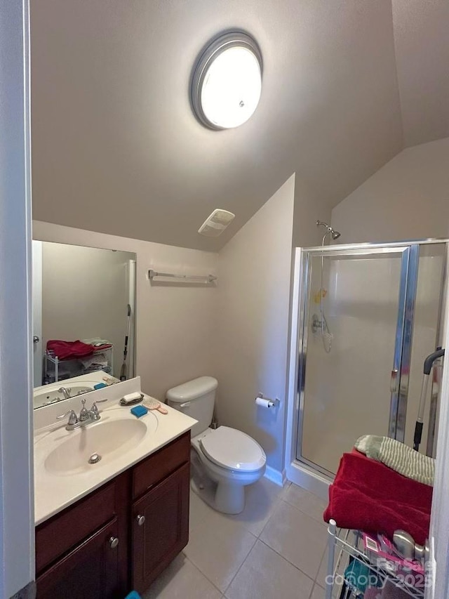 bathroom with tile patterned floors, vanity, a shower with shower door, and lofted ceiling