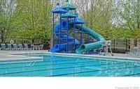 view of pool featuring a playground