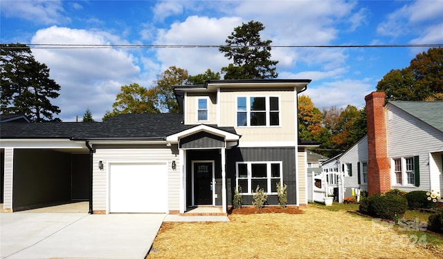 view of front of home featuring a garage, board and batten siding, concrete driveway, and a front yard