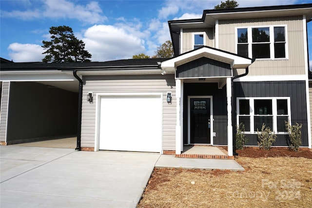 view of front of house featuring concrete driveway