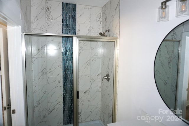 bathroom with a shower stall